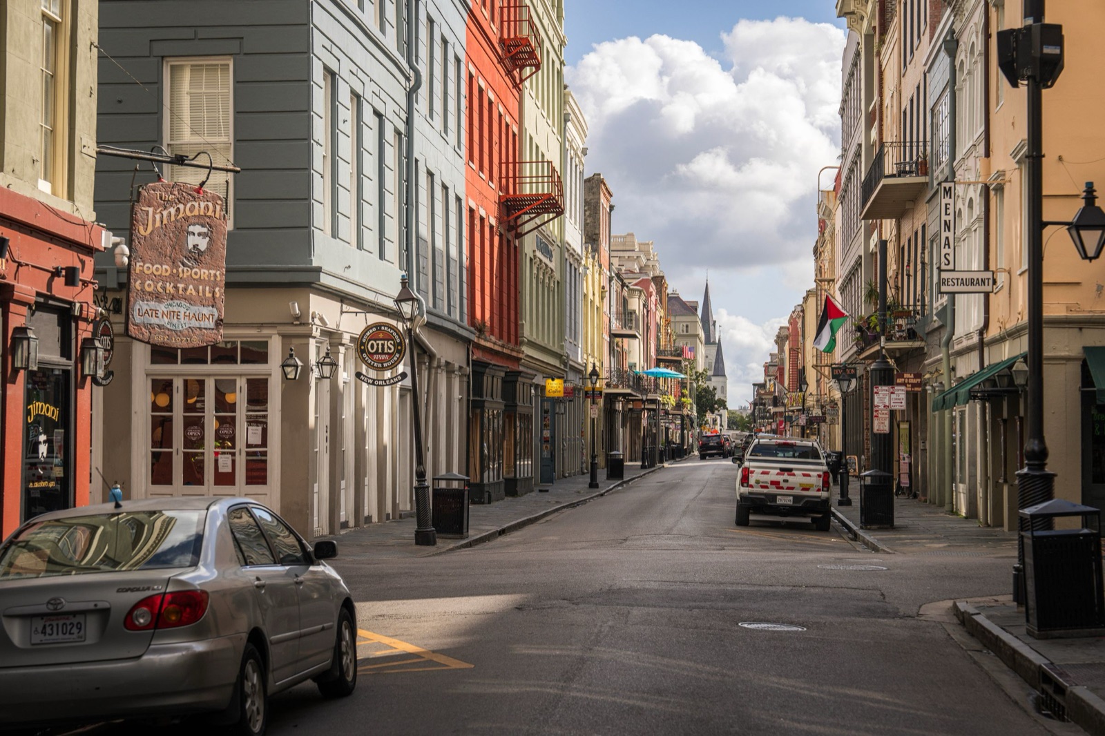 A quiet street of shuttered townhouses in the French Quarter, New Orleans
